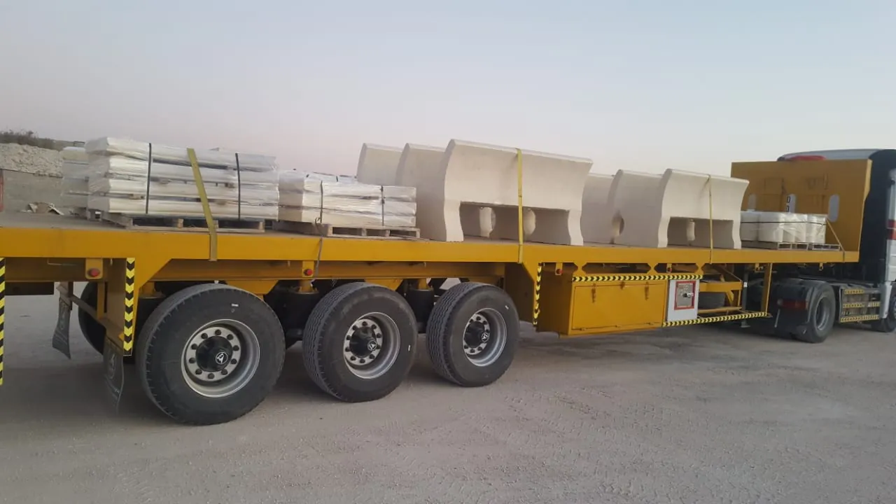 Steel lighting poles arranged inside Aktar's factory in Al-Sulai, Riyadh, after galvanizing, ready for inspection and documentation before shipping